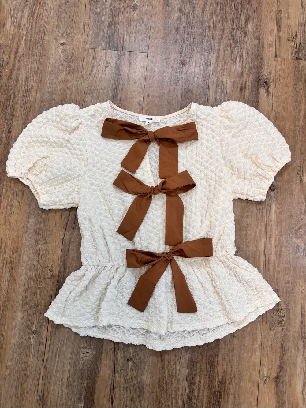 mine Cream Peplum Top with Brown Bow Trim